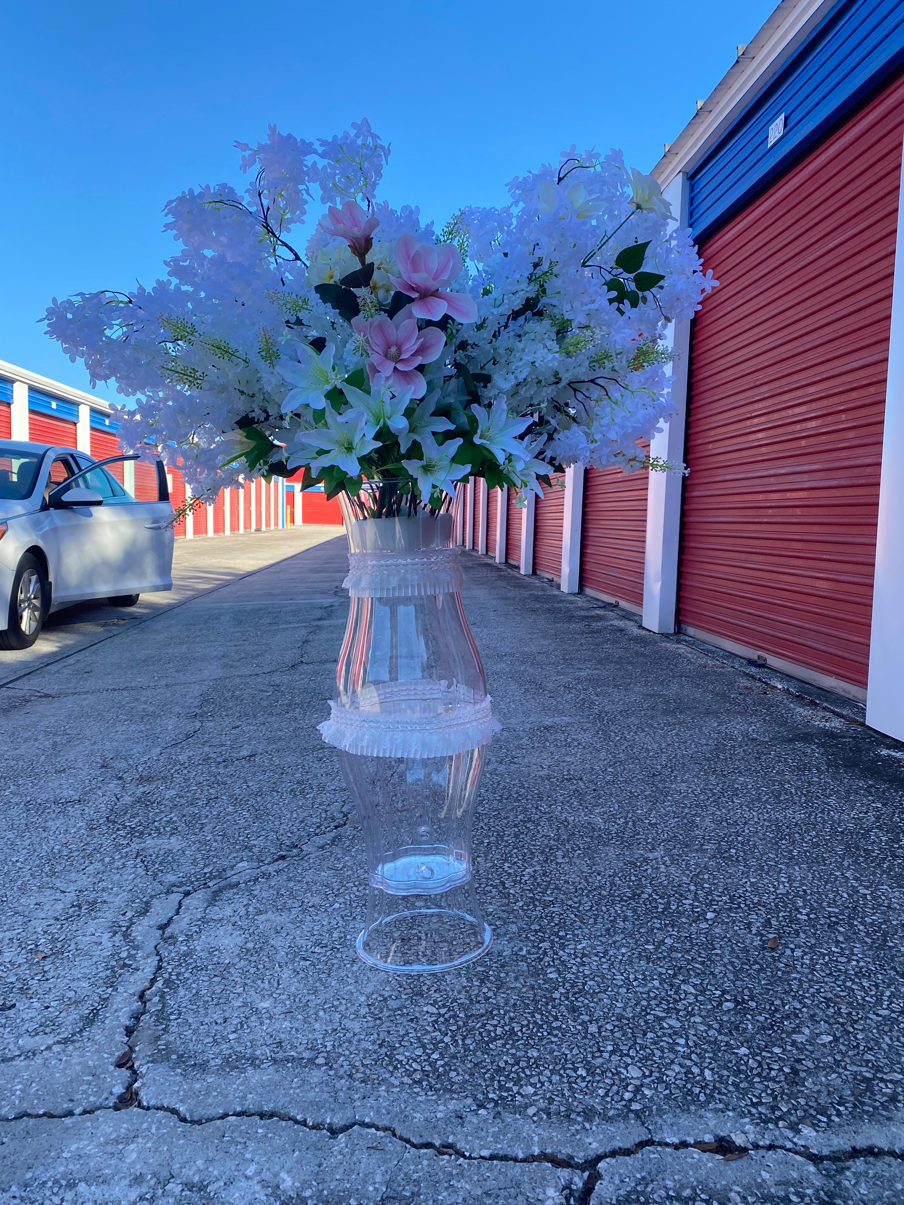 White flower arrangement with hight vase