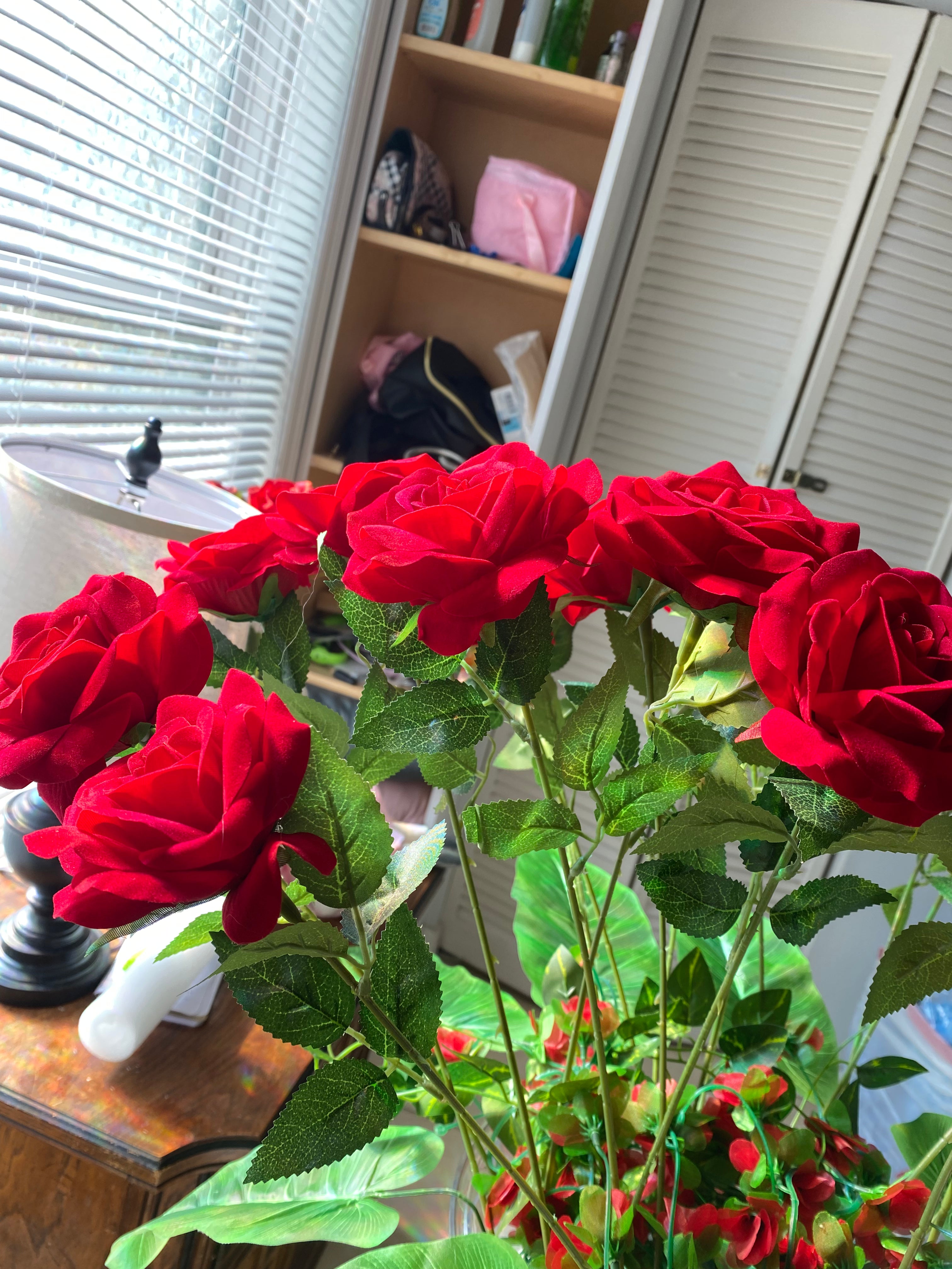 Red flower arrangement with hight vase